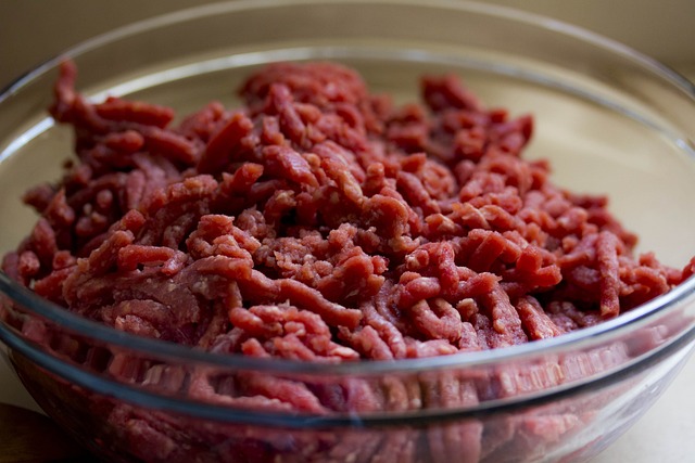 Ground meat in a clear glass bowl