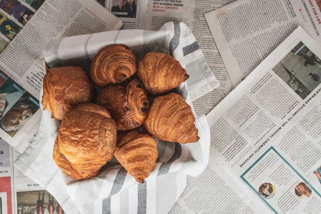 Freshly baked croissant inside a pastry basket