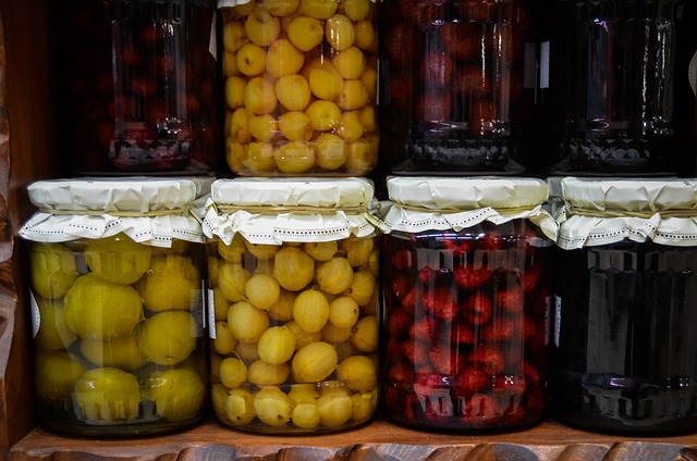 Assorted foods preserved in covered glass jars