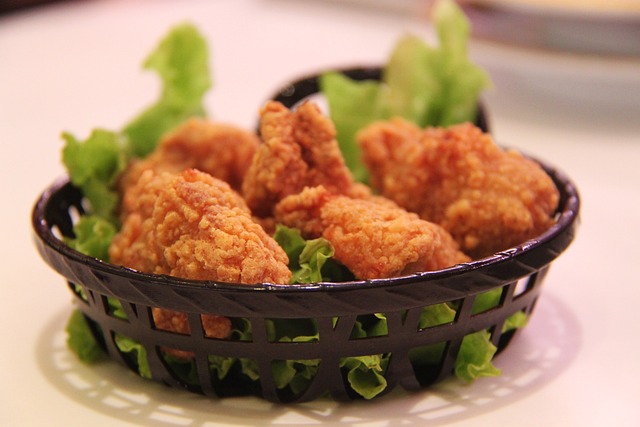 Pieces of fried chicken in a black serving basket
