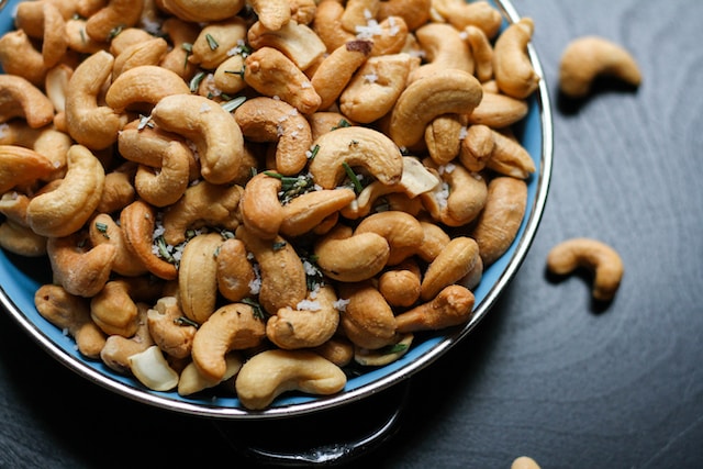 Cashew nuts on a blue plate