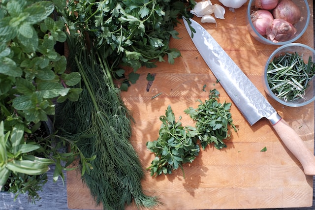 Assorted herbs on a chopping board
