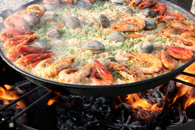 Paella cooking over an open fire