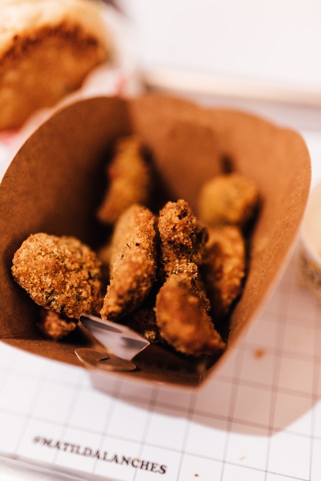 Fried chicken inside a brown carton