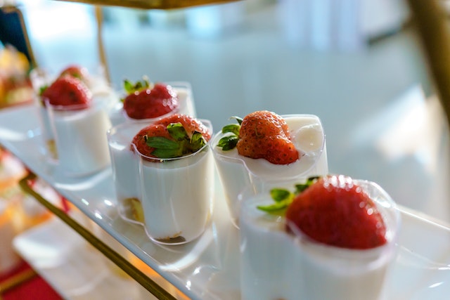 Clear containers with yogurt and strawberries
