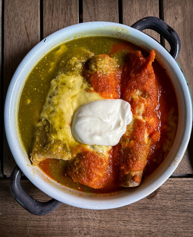 Enchiladas with sauce in ceramic a pan