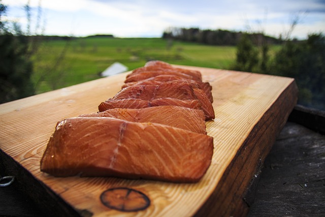 Smoked slices of salmon on a wooden board