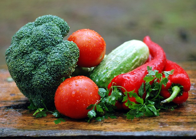 Assorted vegetables on a wooden surface