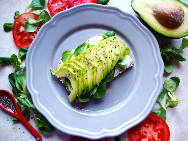Avocado slices topped with sesame seeds on toast