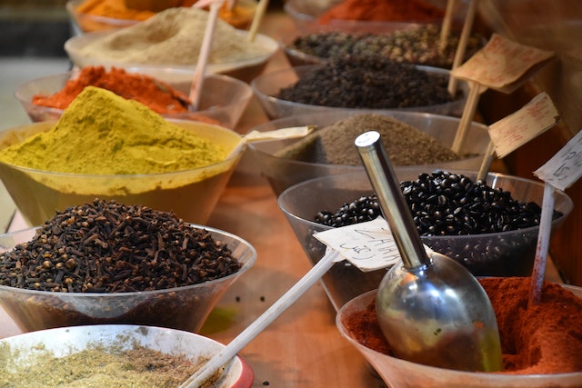 Assorted spices on plastic bowls