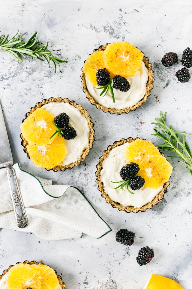 Mini pies topped with fresh fruits